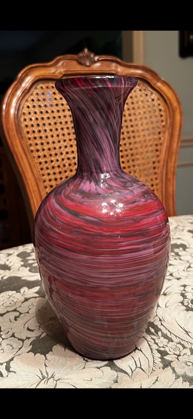 A tall hand-blown glass vase with red and white vertical ribbons — The Glass Whisperer